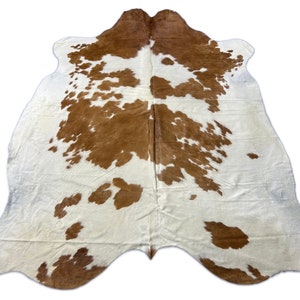 Tapis en peau de vache marron et blanc
